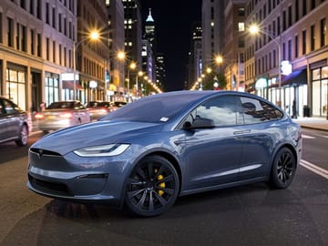 The same vehicle rendered against the city at night backdrop