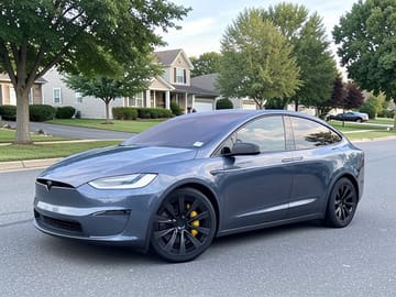 The same vehicle rendered against the residential street backdrop